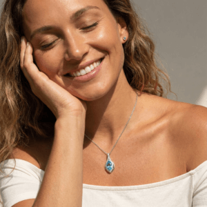 Elegant blue topaz sterling silver necklace worn on model