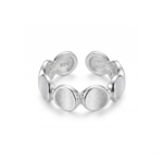 Silver-colored disc open ring on a white background, showing repeating brushed round faces, reflective edges, and separated circular ends at the back.