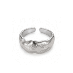 Silver-colored textured open ring on a white background, showing the broad uneven surface, gently wavy edges, and separated rounded ends.