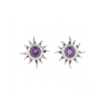 Pair of silver-colored amethyst stud earrings on a white background, with round faceted purple centers framed by textured sunburst rays.